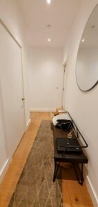 The original hallway looking very bland and uncared for. the space doesnt feel welcoming or create a wow factor.